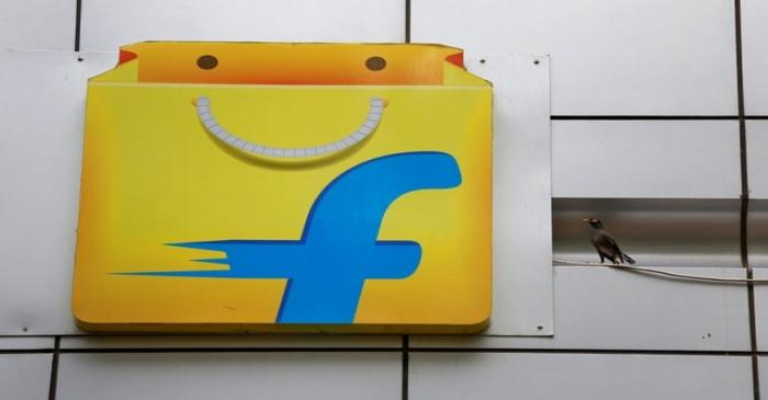FILE PHOTO: A Common myna sits next to the logo of India's e-commerce firm Flipkart installed
