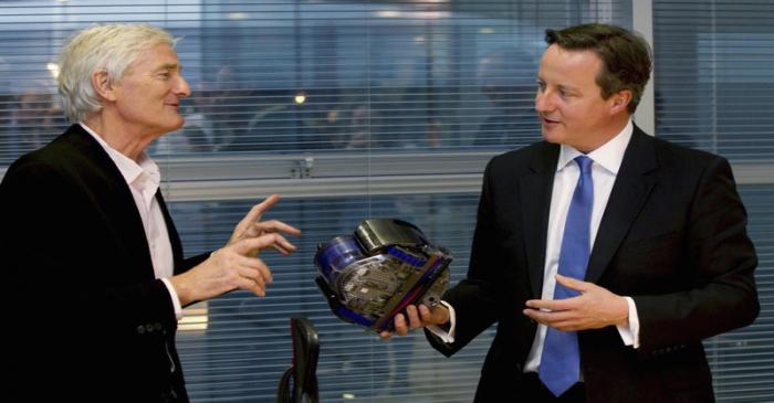 FILE PHOTO: Britain's Prime Minister Cameron views vacuum design products with Dyson at the