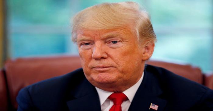 FILE PHOTO: U.S. President Trump listens to question during an interview with Reuters in the
