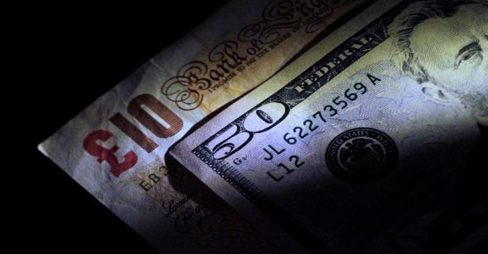 FILE PHOTO: Illustration photo of British Pound Sterling and U.S. Dollar notes