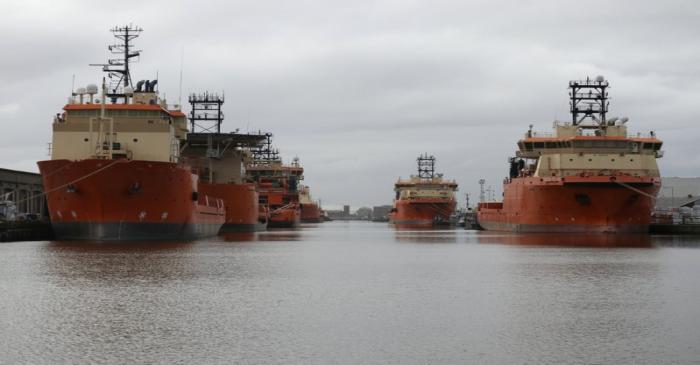 FILE PHOTO: Vessels that are used for towing oil rigs in the North Sea are moored up at William