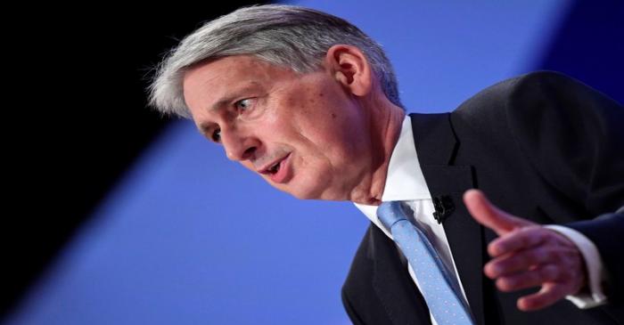 FILE PHOTO:  Britain's Chancellor of the Exchequer Philip Hammond delivers his keynote address
