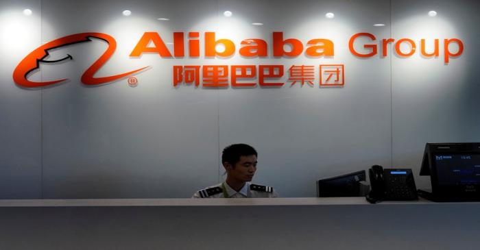FILE PHOTO - The logo of Alibaba Group is seen inside DingTalk office, an offshoot of Alibaba