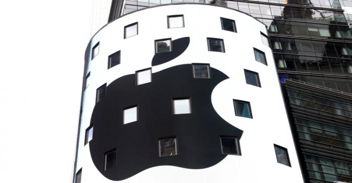 An electronic screen displays the Apple Inc. logo on the exterior of the Nasdaq Market Site