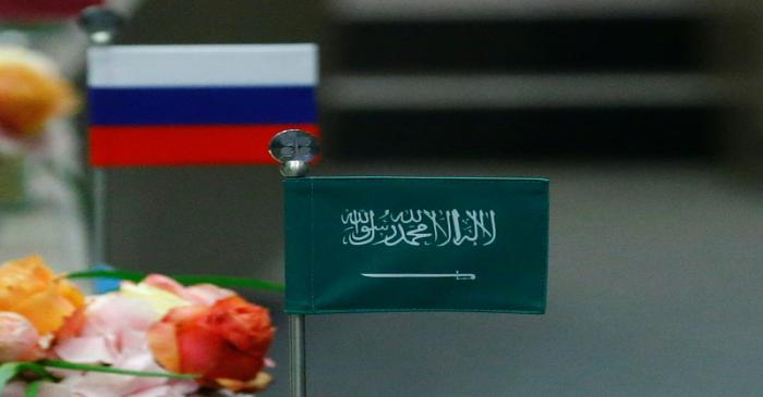 The national flags of Russia and Saudi Arabia are seen during an OPEC meeting in Vienna