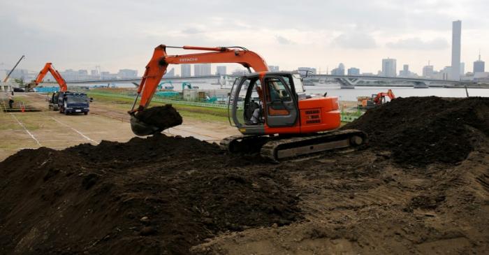 FILE PHOTO: Excavators are seen at a construction site in Tokyo