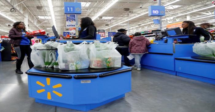Customers complete their purchases ahead of Black Friday at a Walmart store in Chicago