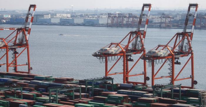 Shipping containers are seen at a port in Tokyo
