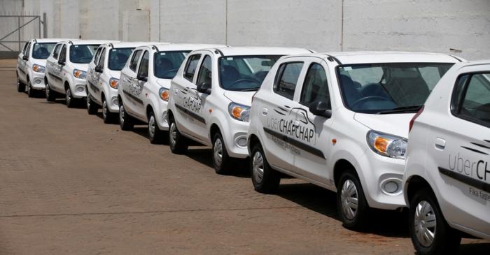 Suzuki cars branded with Uber stickers are seen in a showroom in Nairobi