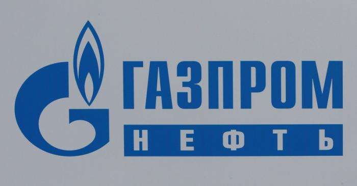 FILE PHOTO: The logo of Russia's oil producer Gazprom Neft is seen on a board at the SPIEF 2017