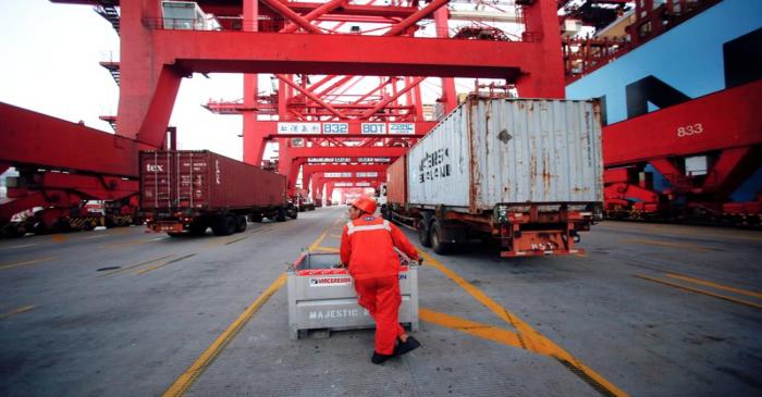 FILE PHOTO: A worker is seen at the Yangshan Deep Water Port, part of the Shanghai Free Trade