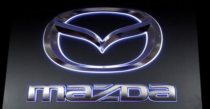 FILE PHOTO: The logo of Mazda Motor Corp. is displayed at the company's news conference venue
