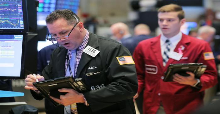 A trader works on the floor at the New York Stock Exchange (NYSE) in New York