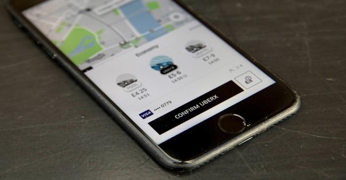 FILE PHOTO: A photo illustration shows the Uber app on a mobile telephone in London
