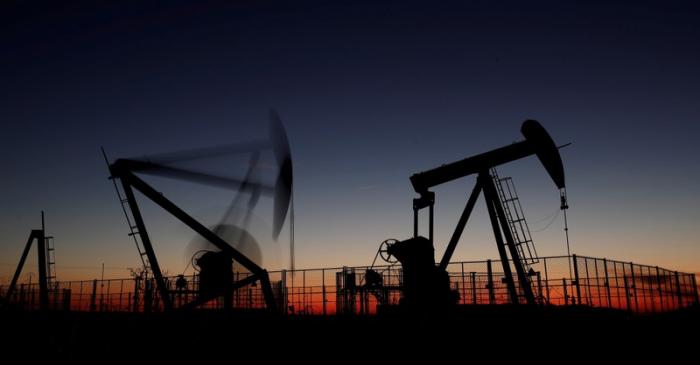 FILE PHOTO: Oil pumps are seen after sunset outside Vaudoy-en-Brie