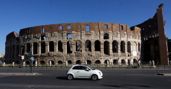 FILE PHOTO: A Fiat 500 is seen in front of the ancient Colosseum in Rome