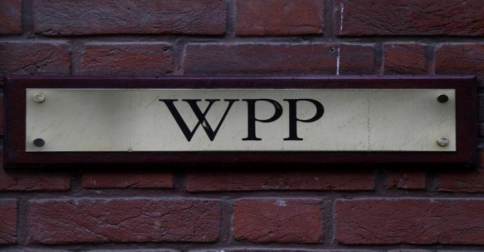 FILE PHOTO: A logo hangs on the wall outside the WPP offices in London