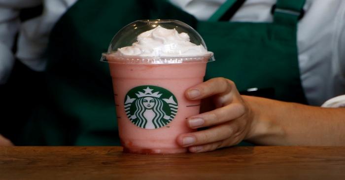 FILE PHOTO: A waitress prepares a beverage at a branch of Starbucks coffee in Tokyo