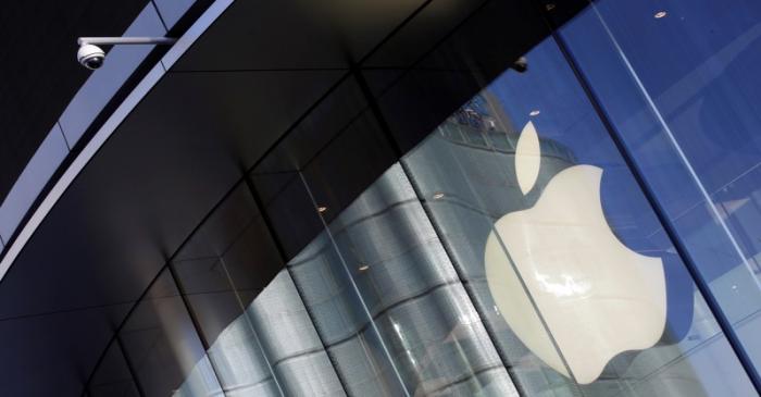 Surveillance camera is seen outside an Apple store in Beijing