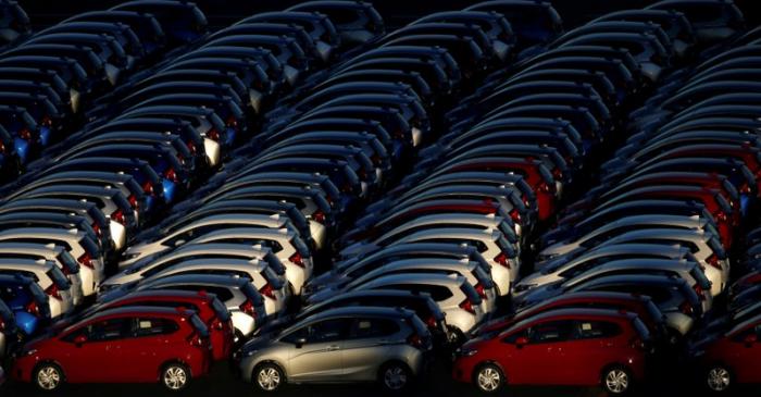 FILE PHOTO - Newly manufactured cars await export at port in Yokohama