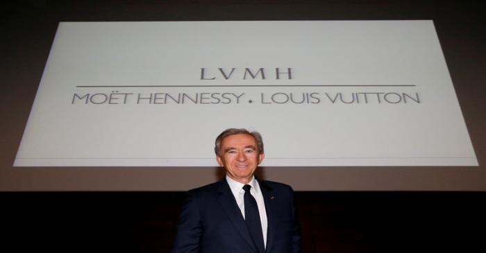 FILE PHOTO: Chairman and CEO of Luxury goods group LVMH Bernard Arnault poses after a news