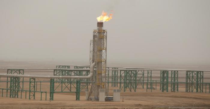 FILE PHOTO: Excess gas is burnt off at a pipeline at the Zubair oilfield in Basra