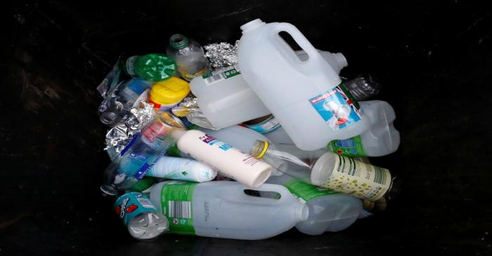 FILE PHOTO: Plastic bottles and containers are seen in a domestic recycling bin in Manchester