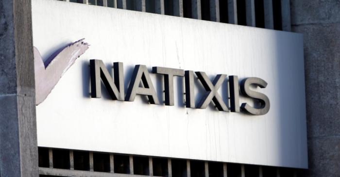 The logo of French bank Natixis is seen outside one of their offices in Paris