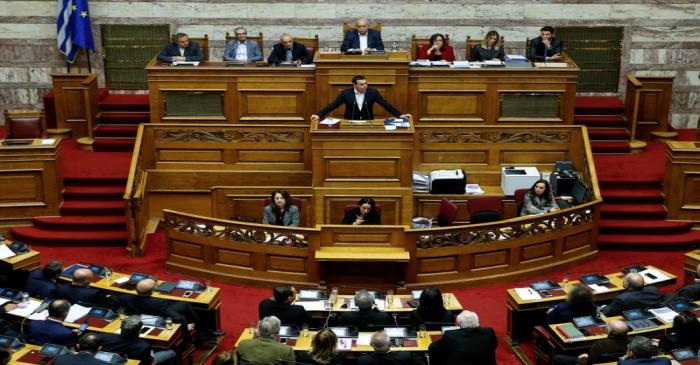 Greek PM Tsipras addresses lawmakers during a parliamentary session before a budget vote in