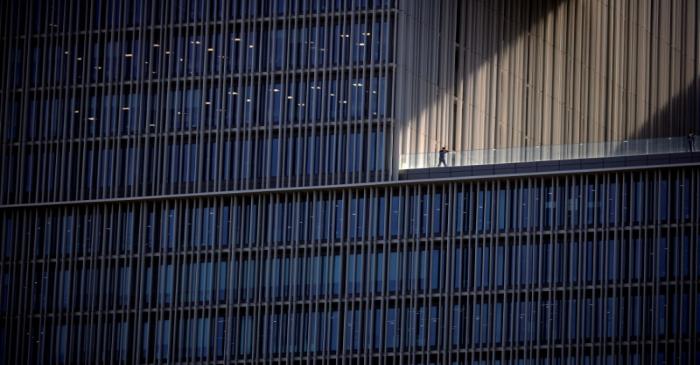 FILE PHOTO: An employee talks on a phone at an office building in Seoul, South Korea