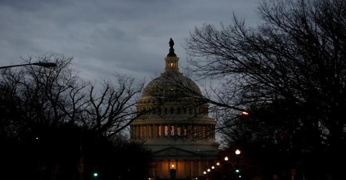 The U.S. Capitol is lit during the second day of a shutdown of the federal government in