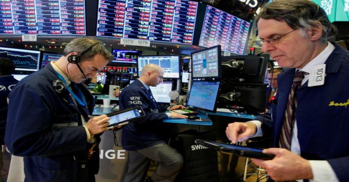Traders work on the floor of the New York Stock Exchange (NYSE) in New York