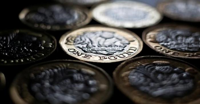 FILE PHOTO: Pound coins are seen in the photo illustration taken in Manchester, Britain