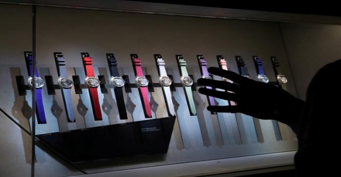 FILE PHOTO: Visitors look at watches at the Audemars Piguet stand at the 