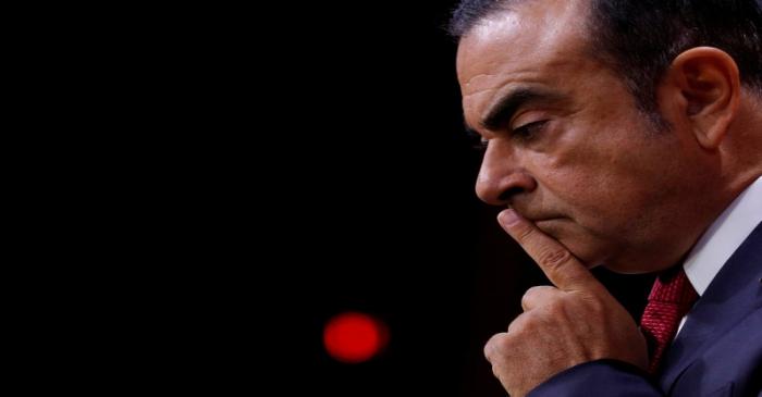 FILE PHOTO: Carlos Ghosn, Chairman and CEO of the Renault-Nissan Alliance, reacts during a news