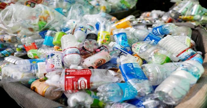 FILE PHOTO: Used plastic bottles are seen at a waste collection point in Tokyo
