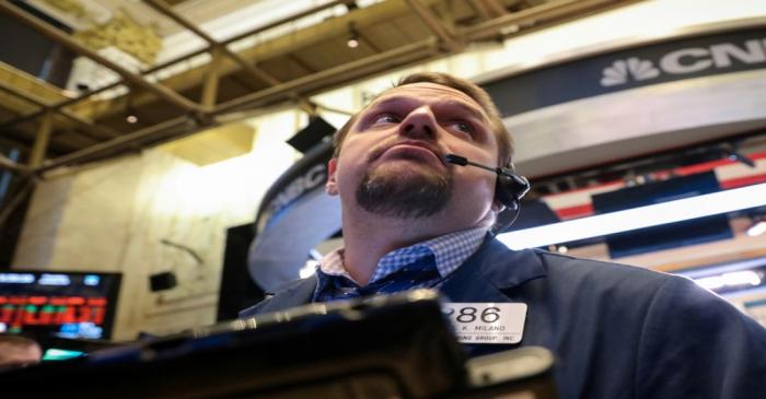 FILE PHOTO: A trader works on the floor of the NYSE in New York