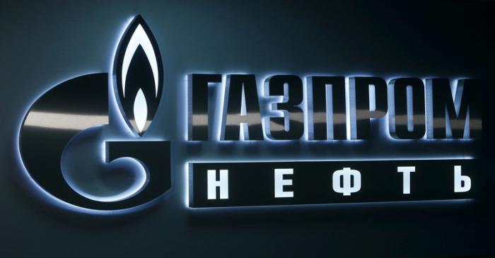 FILE PHOTO:  Sign displaying the logo of Russia's Gazprom Neft oil company is seen at company's