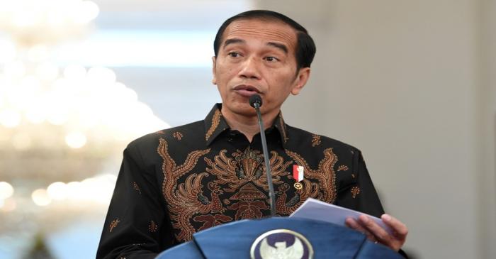 FILE PHOTO:  Indonesian President Joko Widodo speaks to the media about the deaths of