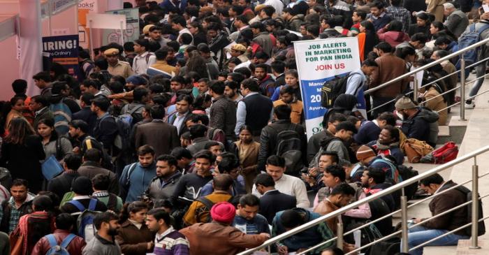 Job seekers attend a job fair organised by the employment department of the Delhi state
