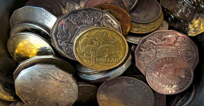 FILE PHOTO:  An Australian one dollar coin can be seen amongst various other Australian coins