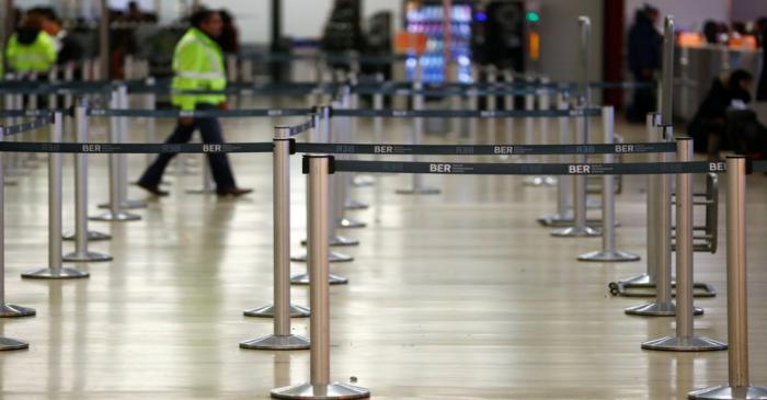 An empty check-in counters are pictured as members of unions take part in a strike by ground