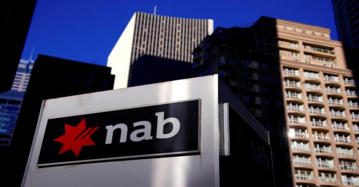 FILE PHOTO - The logo of the National Australia Bank is displayed outside their headquarters