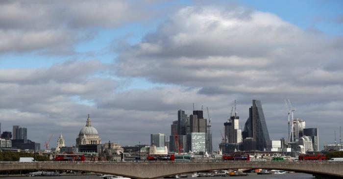 FILE PHOTO: Buildings in the City of London are seen behind Waterloo Bridge in London