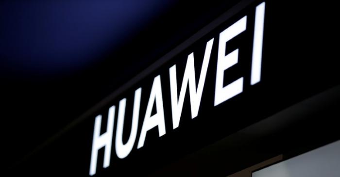 FILE PHOTO: A sign of Huawei is pictured at its shop in Beijing