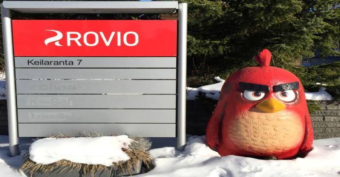 A Rovio sign and a figure of an Angry Birds character are seen in front of Rovio's headquarters