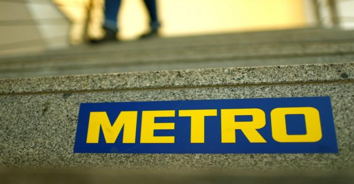 FILE PHOTO: German retailer Metro AG sign is seen on the steps of their headquarters in