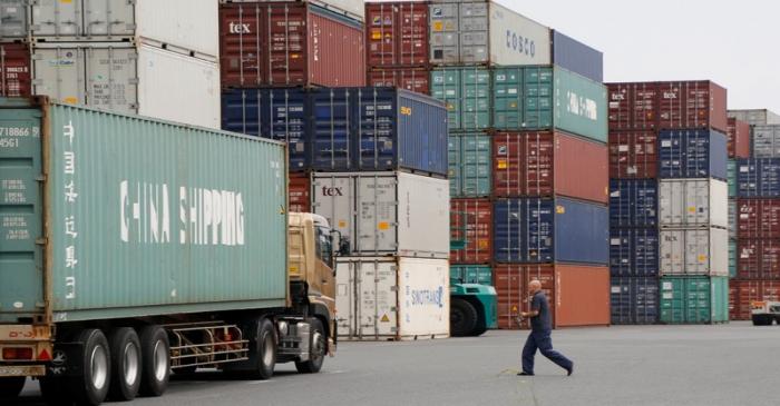 FILE PHOTO: A laborer works in a container area at a port in Tokyo