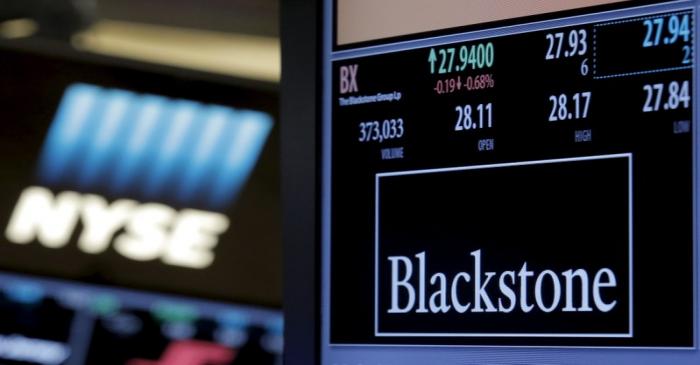 FILE PHOTO:  The ticker and trading information for Blackstone Group is displayed at the post