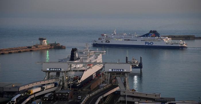 A ferry departs for France at dusk at the Port of Dover